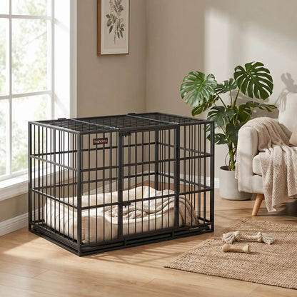 Cage-chien-interieur-chiot-xl en acier noir robuste avec 4 verrous, deux porte sur le toit et le devant pour le chien, plateau en fond amovible ramasse saleté pour un nettoyage facile et rapide gilles intérieur adapté aux chiens à pattes courtes, rectangulaire pour chiot et chien de moyenne à grande taille juqu'à 40 kg-gros plan sur la cage sécurisée en acier et metal solide pour chiot et chien  dans le salon de l'appartement